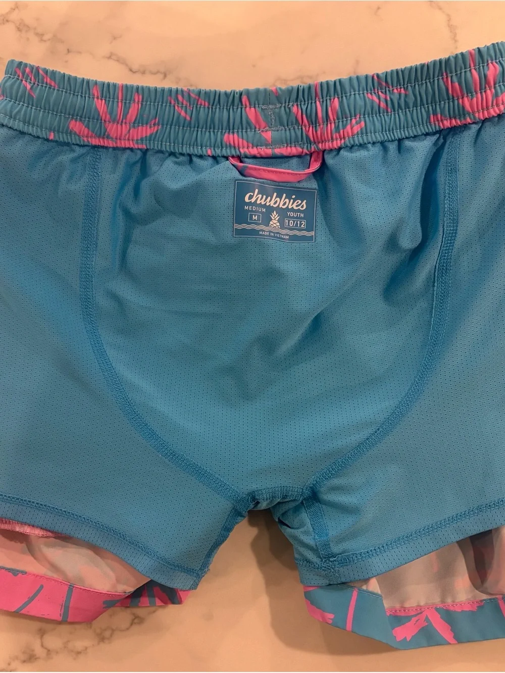 Chubbies. Boy 10-12yrs. Palm Tree Swim Shorts in Pink & Teal